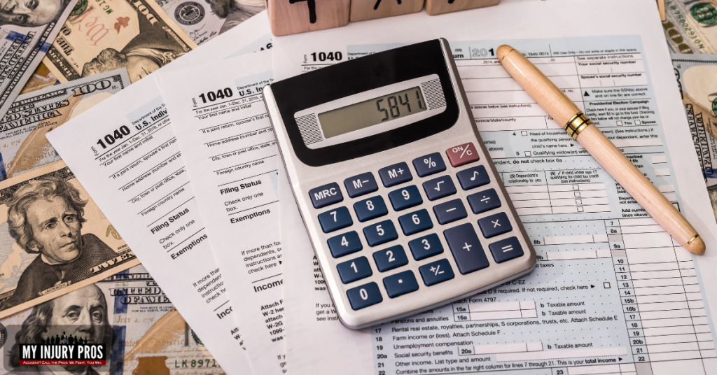 IRS tax forms and calculator illustrating the rules for Do I Have To Report Personal Injury Settlement To IRS.