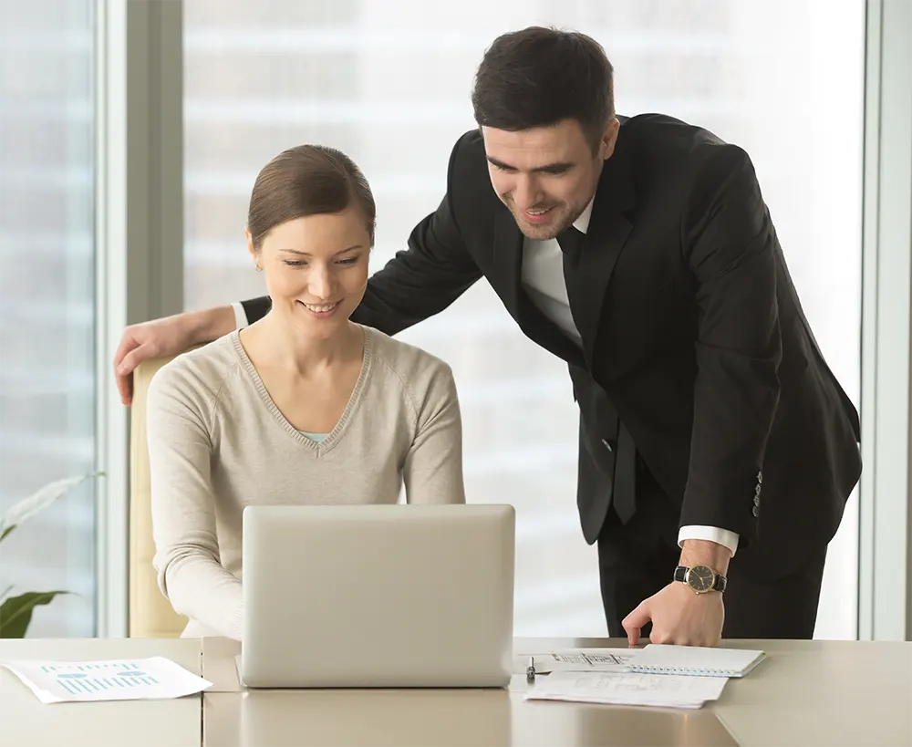 happy-company-employees-using-laptop-office-img