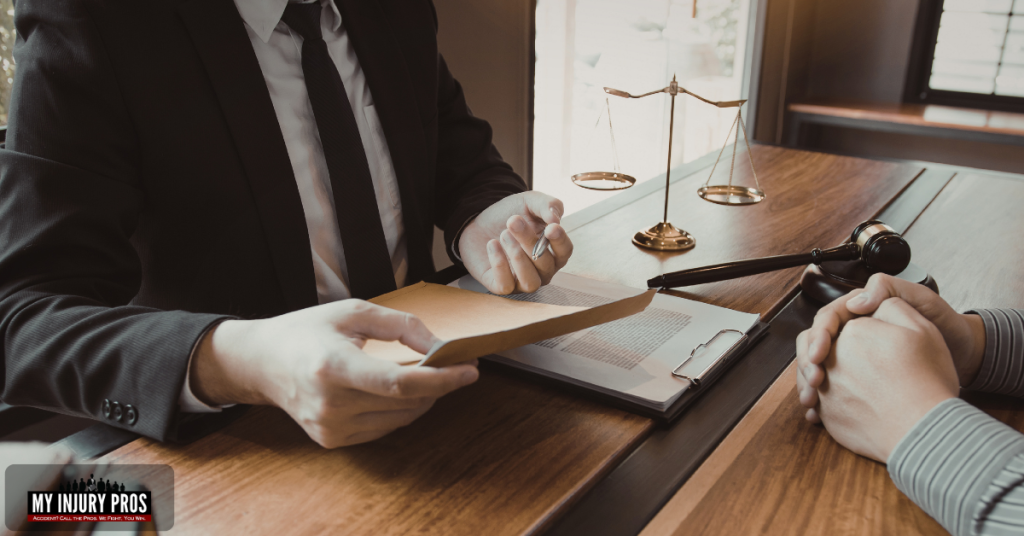 car accident lawyer reviewing insurance claim documents for an injury case