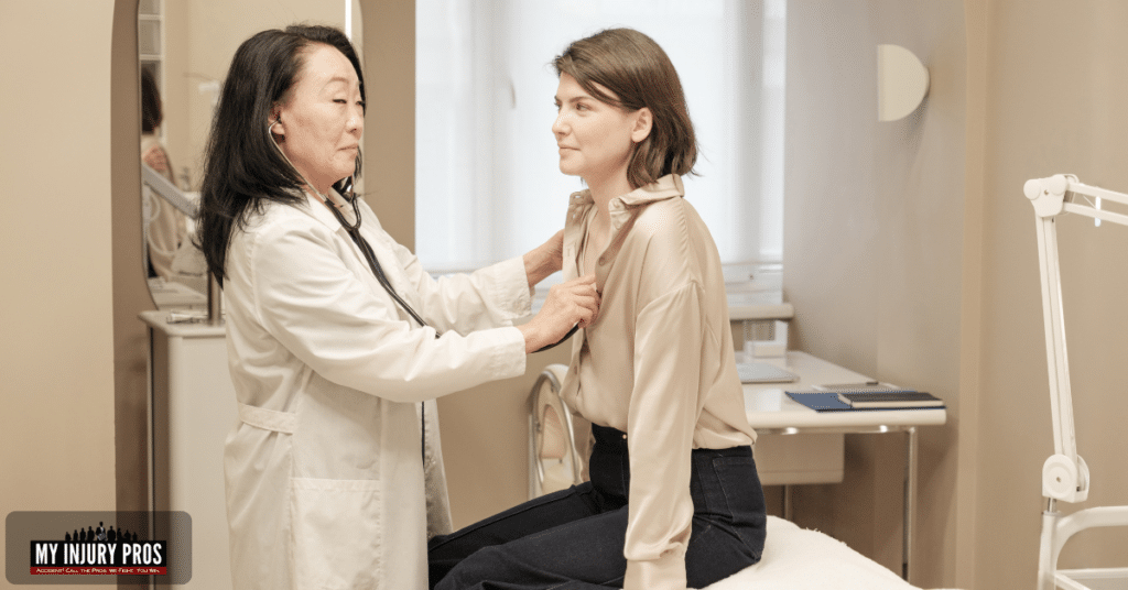 sternum pain after car accident doctor reviewing chest x ray for injury diagnosis